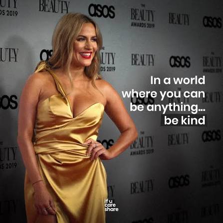 Caroline Flack at the ASOS Beauty Awards beside the message: in a world where you can be anything, be kind