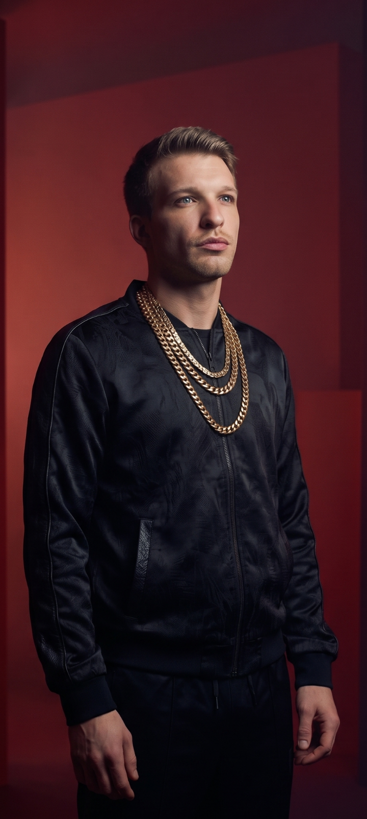 Travis Simpkins portrait against a deep red backdrop